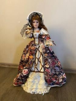 Vintage Victorian Porcelain Doll with curly hair