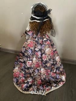 Vintage Victorian Porcelain Doll with curly hair