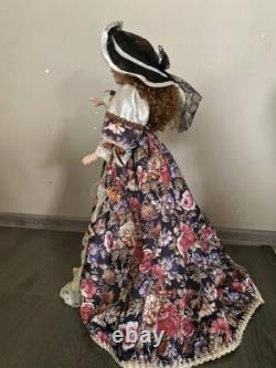 Vintage Victorian Porcelain Doll with curly hair