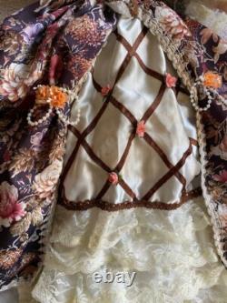 Vintage Victorian Porcelain Doll with curly hair