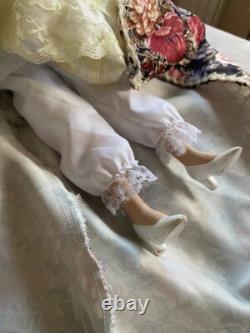 Vintage Victorian Porcelain Doll with curly hair