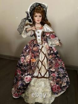 Vintage Victorian Porcelain Doll with curly hair