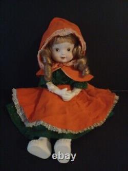 Vintage porcelain doll cloth body