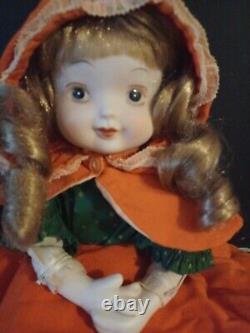 Vintage porcelain doll cloth body