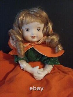 Vintage porcelain doll cloth body