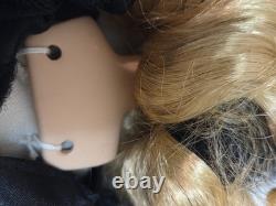 Vintage porcelain witch doll featuring blonde curly hair, a black witch hat Vintage porcelain witch doll featuring blonde curly hair, a black witch hat