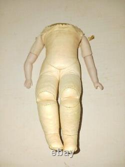 Vintage possibly antique pink leather withporcelain arms & hands doll body