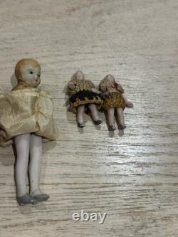 Ensemble de 4 poupées en porcelaine anciennes