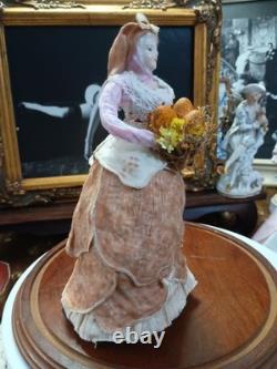 Figurine de poupée en porcelaine vintage vendeuse de melons
