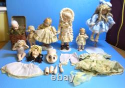 Lot de poupées en porcelaine vintage et boîte à musique Jack-in-the-box avec accessoires supplémentaires