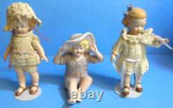 Lot de poupées en porcelaine vintage et boîte à musique Jack-in-the-box avec accessoires supplémentaires