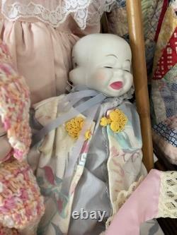Neuf poupées antiques/vintage uniques à trois visages : heureuse, en pleurs, endormie, plus beaucoup de tissus