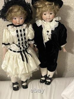 Paire de poupées en porcelaine Vintage 15 avec têtes à douille, corps en cuir et yeux Googly