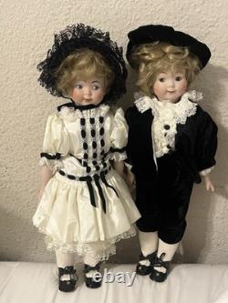 Paire de poupées en porcelaine Vintage 15 avec têtes à douille, corps en cuir et yeux Googly