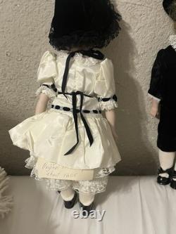 Paire de poupées en porcelaine Vintage 15 avec têtes à douille, corps en cuir et yeux Googly