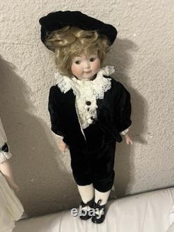 Paire de poupées en porcelaine Vintage 15 avec têtes à douille, corps en cuir et yeux Googly