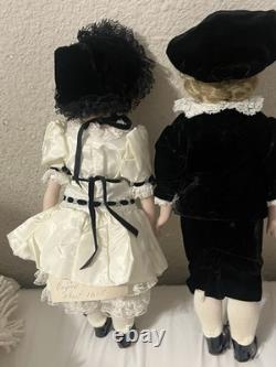 Paire de poupées en porcelaine Vintage 15 avec têtes à douille, corps en cuir et yeux Googly