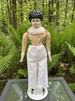Poupée en porcelaine 21 têtes épaules en fine china bras et jambes cheveux noirs allemands