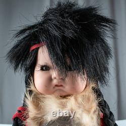 Poupée vintage en porcelaine d’un garçon cheyenne amérindien papoose