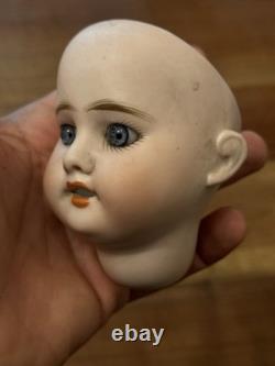 Tête de poupée en porcelaine antique jouet vintage taille 1 non signée