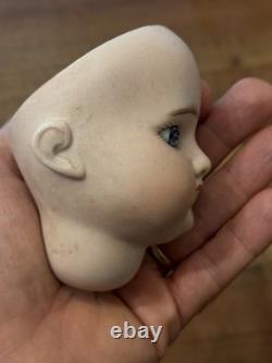 Tête de poupée en porcelaine antique jouet vintage taille 1 non signée