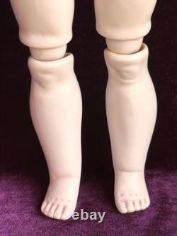 Vintage toute en porcelaine, reproduction n°19 d’une poupée française ancienne Bru à cercle pointillé
